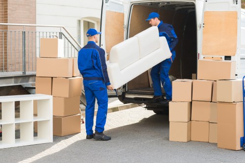 Removal van and packed boxes in a Notting Hill street setting