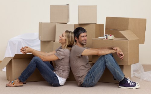 Movers preparing equipment safely before a relocation job