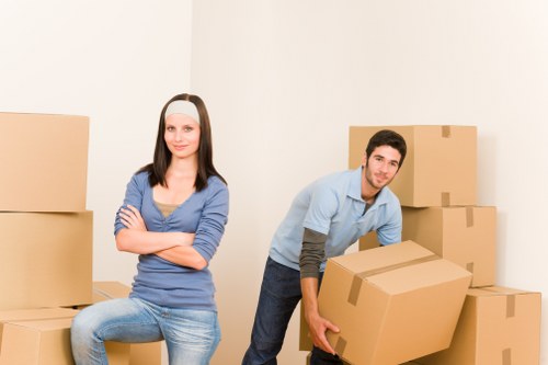 Removal team loading furniture for a student flat move in West London