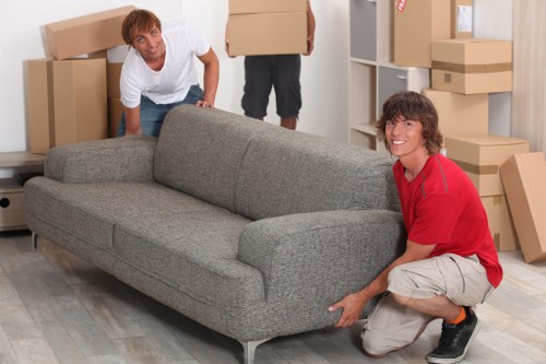 Local van service loading furniture near Notting Hill streets