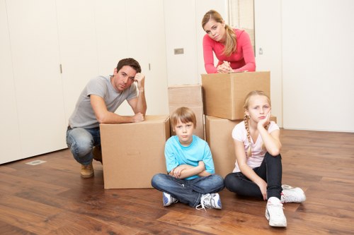 Careful packing and wrapping of fragile home items during a local move