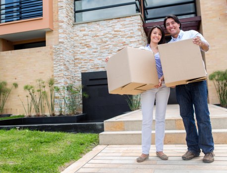 Local movers handling furniture in a Notting Hill property
