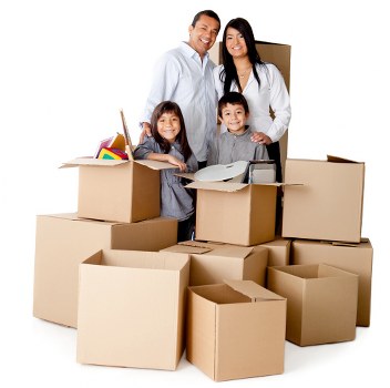 Trained moving staff carrying boxes carefully in a property